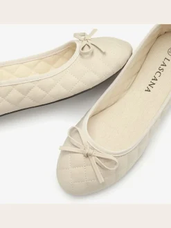 Ballerines classiques à la coupe arrondie avec nœuds