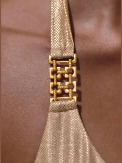 Bikini triangle avec revêtement brillant et boucles décoratives