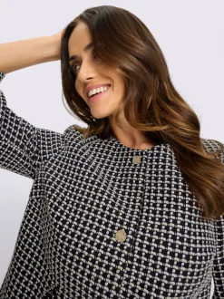 Blazer bouclé doux avec boutons fantaisie et volants
