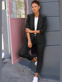 Blazer court à carreaux avec col à revers et poches passepoilées