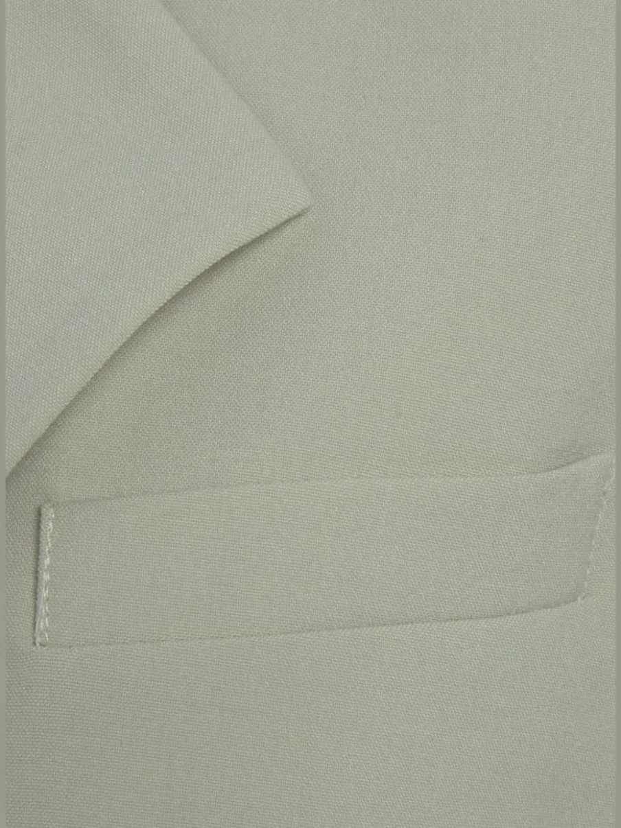 Blazer court à col à revers avec manches longues et poches
