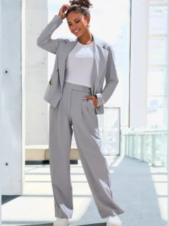 Blazer court à col à revers avec manches longues et poches