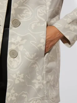 Blazer long à col rond et à patte de boutonnage avec motif floral