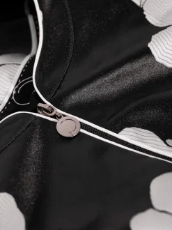 Blazer à motifs floraux en col rond avec poches passepoilées