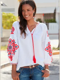 Blouse à manches larges avec broderie et houppes décoratives