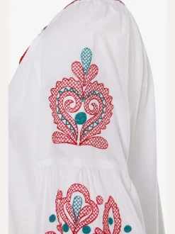Blouse à manches larges avec broderie et houppes décoratives