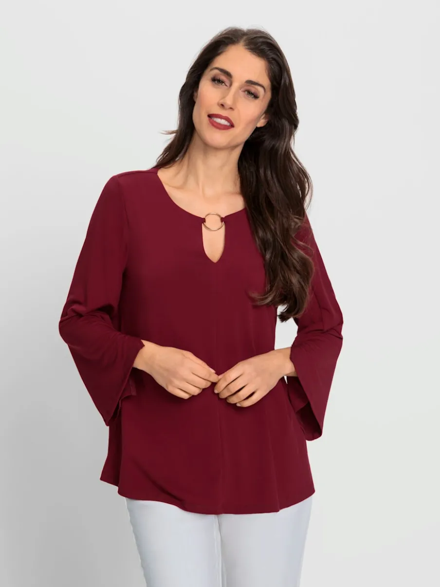 Blouse à manches trompette détails anneau fantaisie fluide