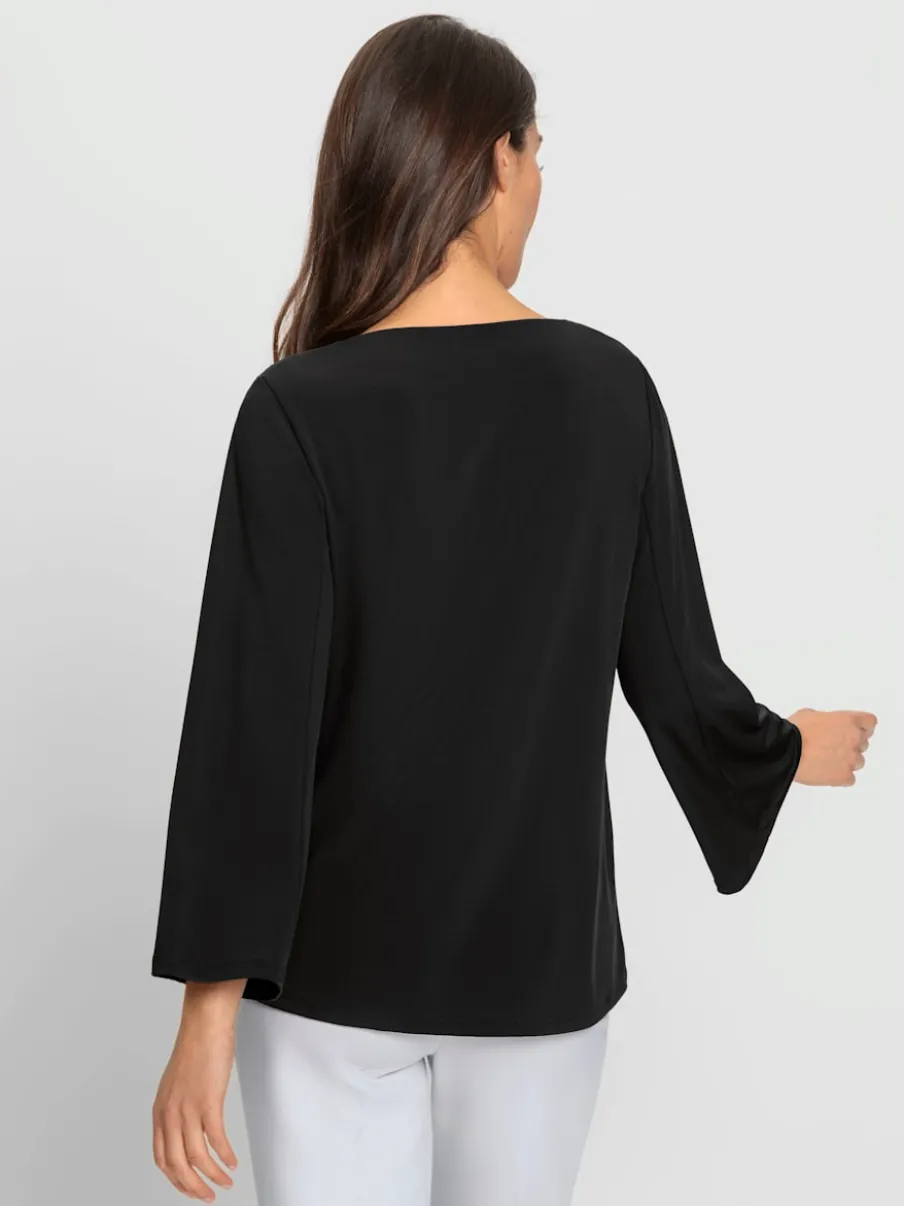 Blouse à manches trompette détails anneau fantaisie fluide