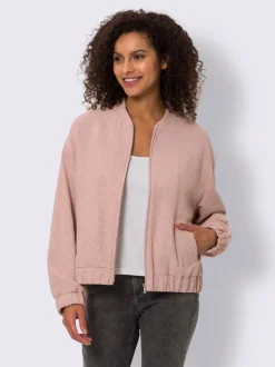 Blouson en bouclé avec petit col montant et poches
