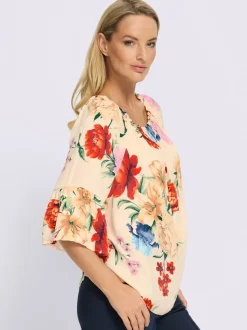 Chemisier à encolure Carmen avec motifs floraux et manches 3/4 volantes