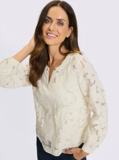 Chemisier en dentelle florale transparent avec manches longues
