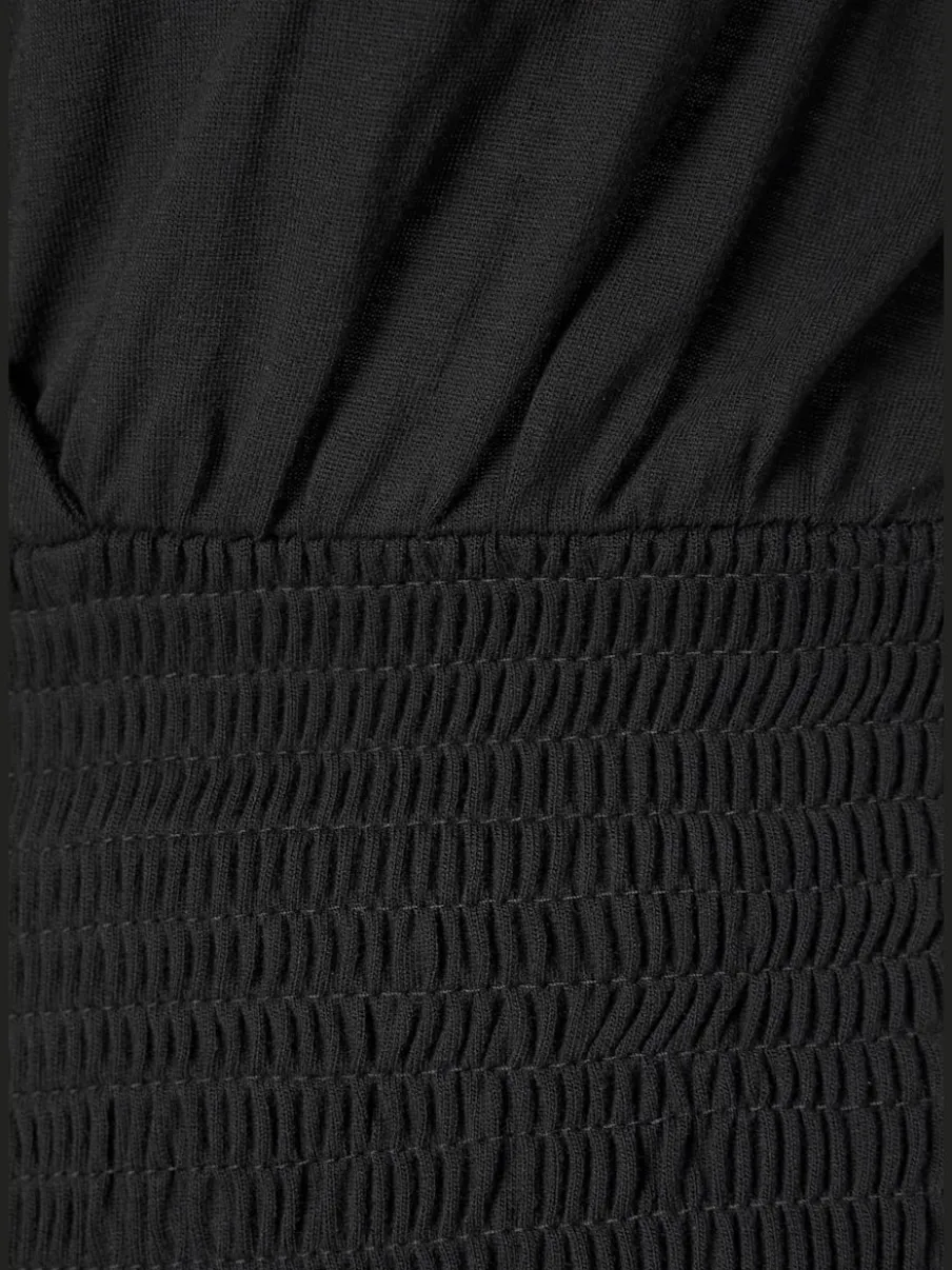 Combinaison col V effet cache-cœur à bretelles et jambes amples