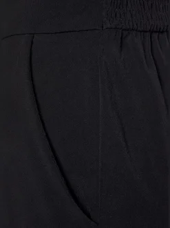Combinaison longue à encolure en V avec motifs floraux et taille élastiquée