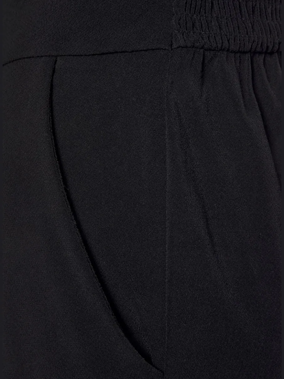 Combinaison longue à encolure en V avec motifs floraux et taille élastiquée