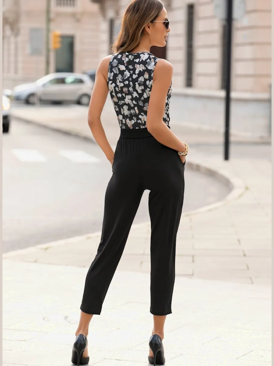 Combinaison longue à encolure en V avec motifs floraux et taille élastiquée