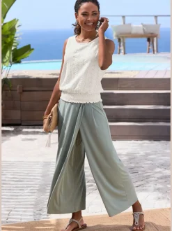 Débardeur d'été sans manches avec motif ajouré et ceinture smockée