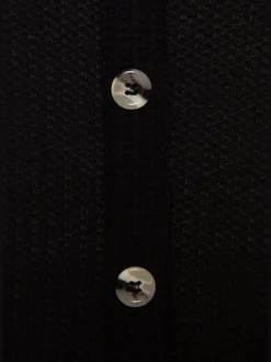 Débardeur sans manches avec patte de boutonnage et ceinture élastiquée