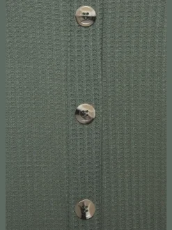 Débardeur sans manches avec patte de boutonnage et ceinture élastiquée