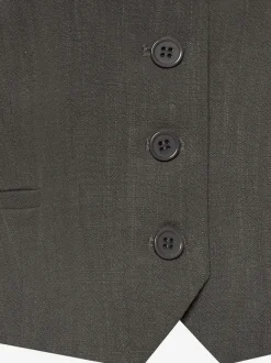 Gilet court à encolure en V avec patte de boutonnage