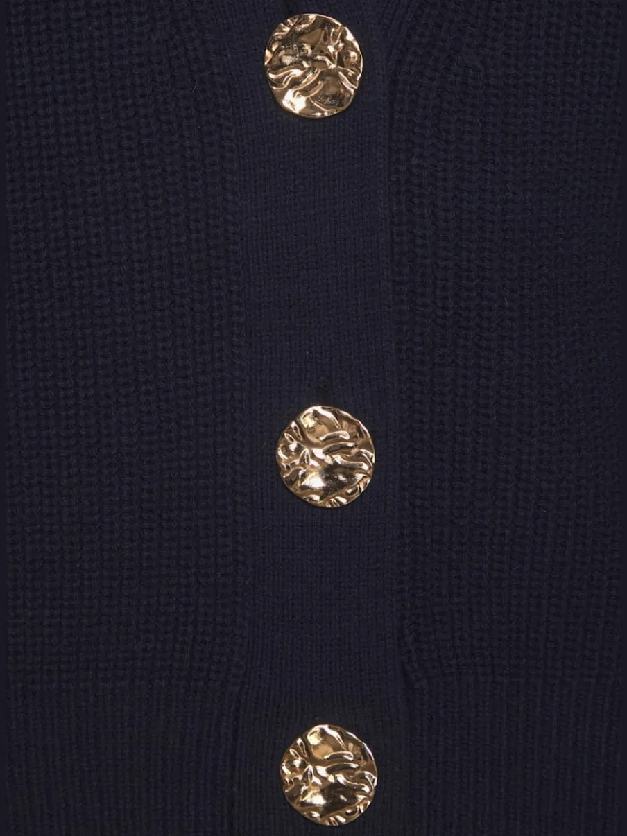Gilet en tricot à col V profond avec boutons dorés et bords-côtes