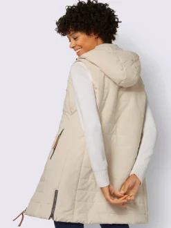 Gilet long matelassé avec col montant et capuche amovible