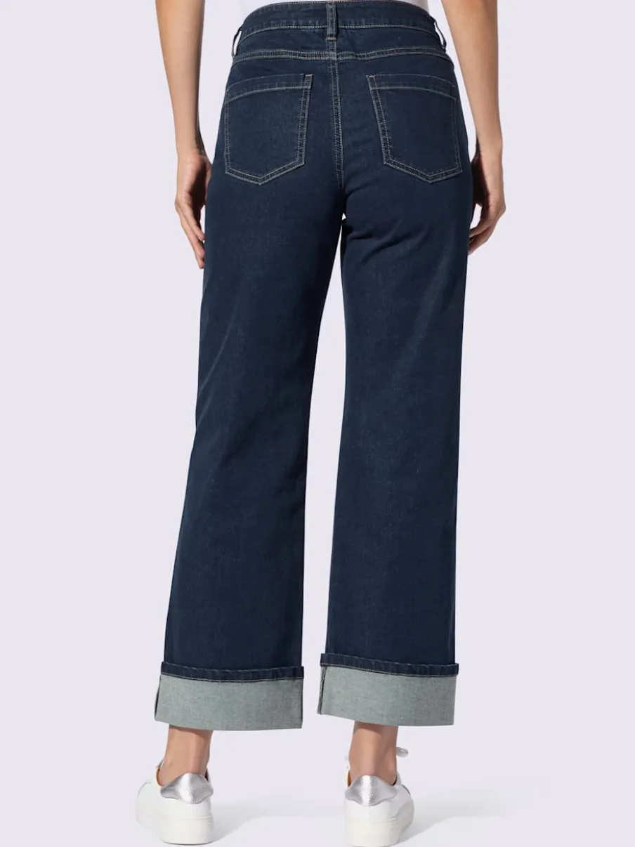 Jean cinq poches avec revers fixe jambes larges