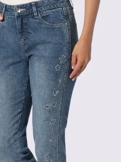 Jean décontracté avec broderies et motif papillon