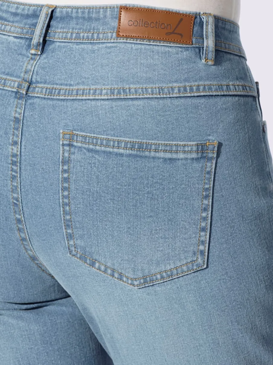Jean effet délavé avec poches et ceinture gainante