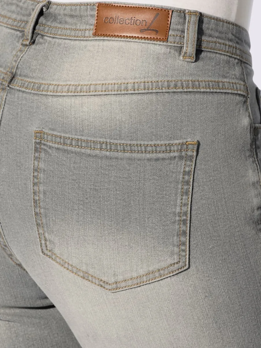 Jean effet délavé avec poches et ceinture gainante
