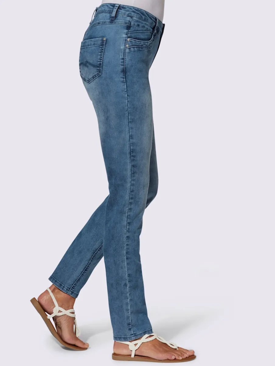 Jean extensible cinq poches avec rivets décoratifs arrière