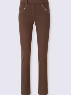 Jean extensible à fausse fermeture avec pierres brillantes et fente