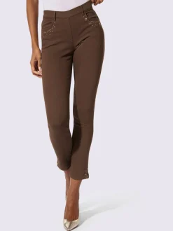 Jean extensible à fausse fermeture avec pierres brillantes et fente