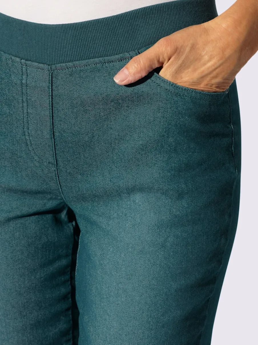 Jean facile à enfiler avec ceinture élastique intégrée.