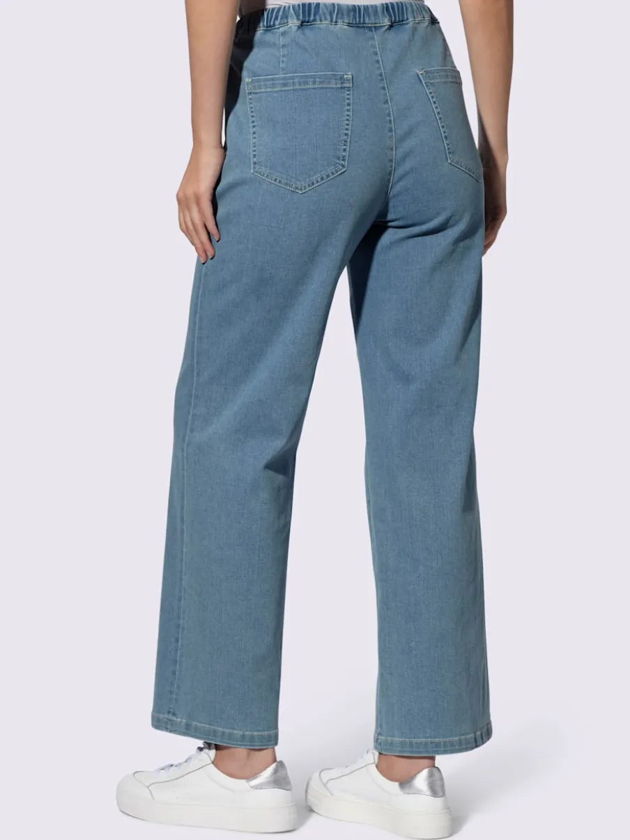 Jean à la coupe large avec ceinture élastique ajustable