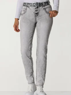 Jean skinny effet délavé avec broderies et boutons fantaisie