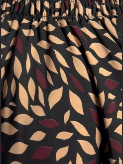 Jupe-culotte à jambes extra-larges avec ceinture froncée et ourlet ondulé