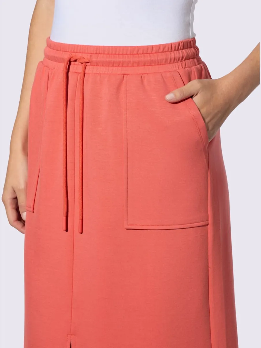 Jupe en jersey avec ceinture élastique et poches plaquées