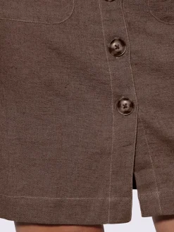 Jupe estivale en lin avec patte de boutonnage et poches.