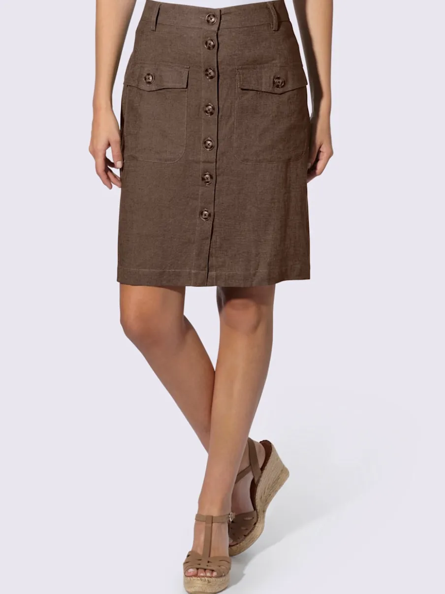 Jupe estivale en lin avec patte de boutonnage et poches.