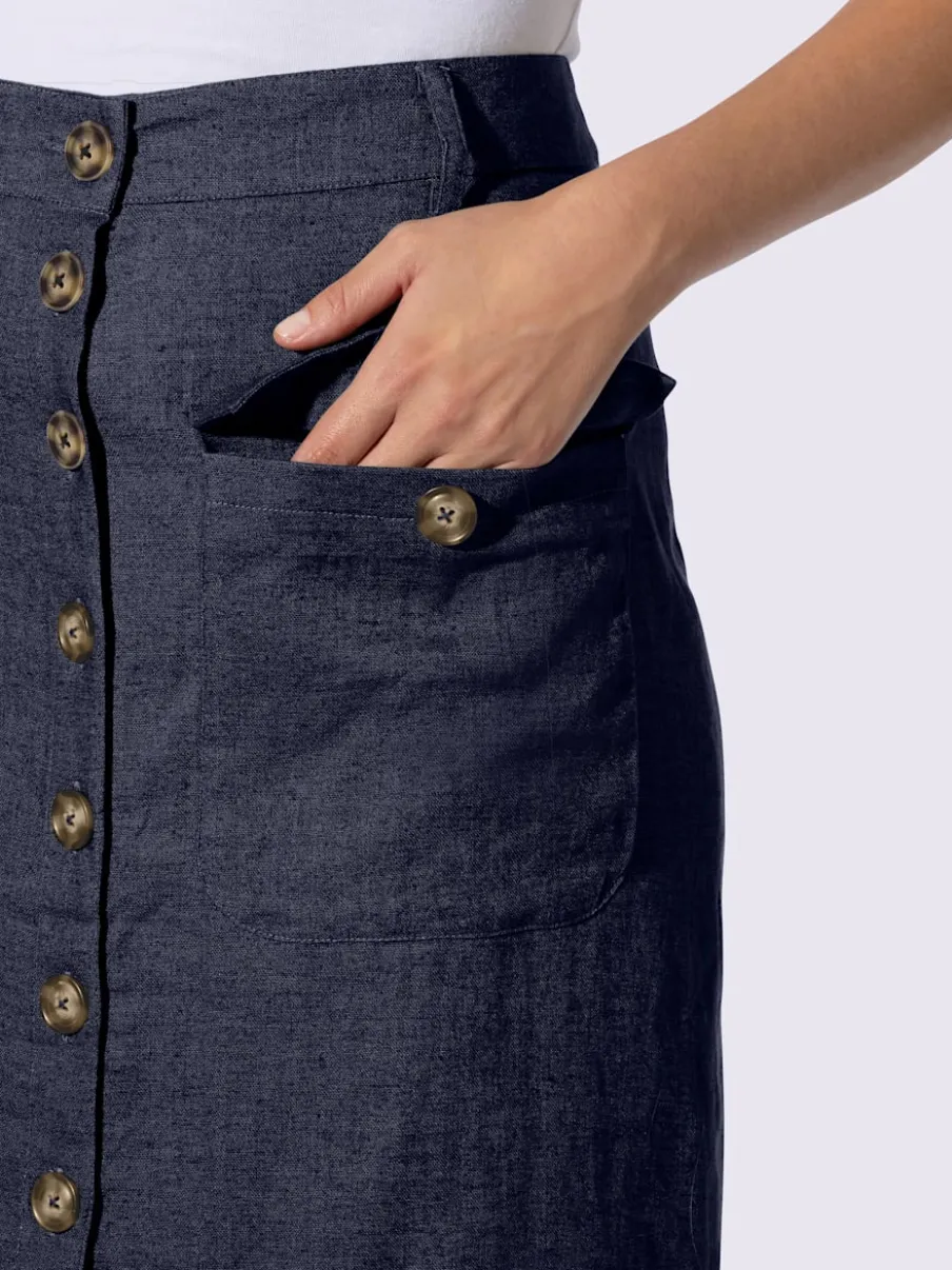 Jupe estivale en lin avec patte de boutonnage et poches.