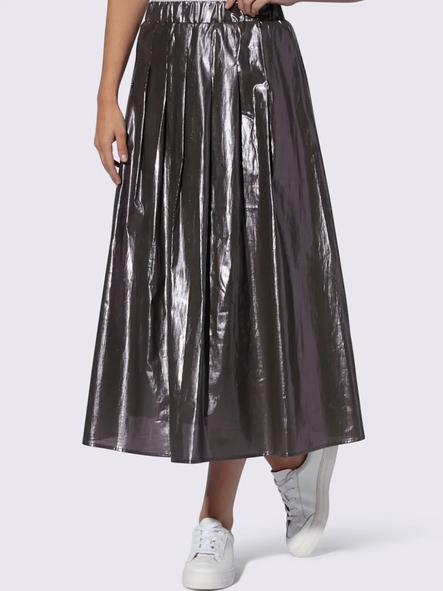 Jupe plissée avec ceinture élastique en tissu.