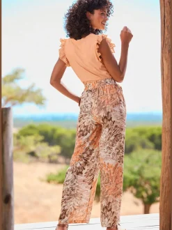 Large pantalon en tissu en viscose avec ceinture élastique et poches