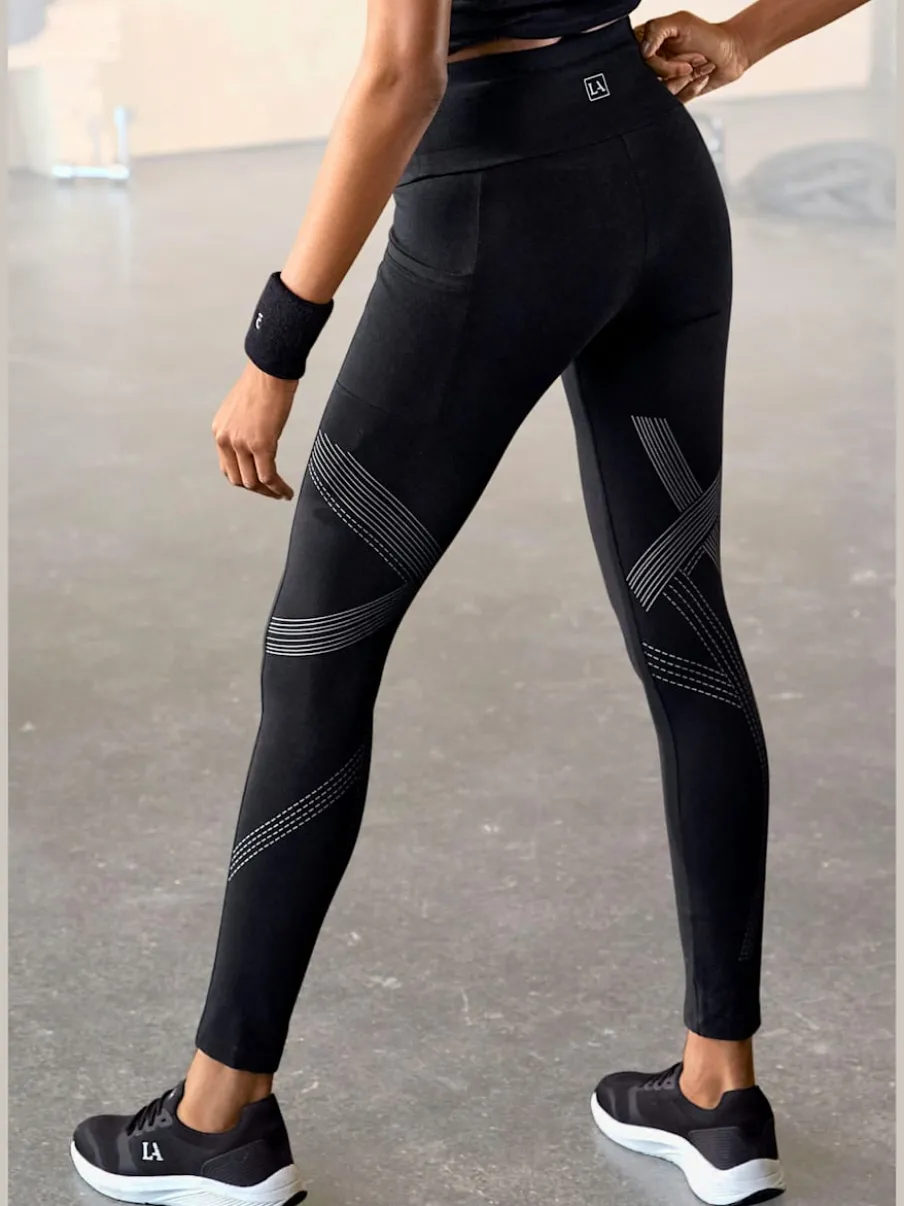 Leggings avec motifs réfléchissants et poche téléphone pratique