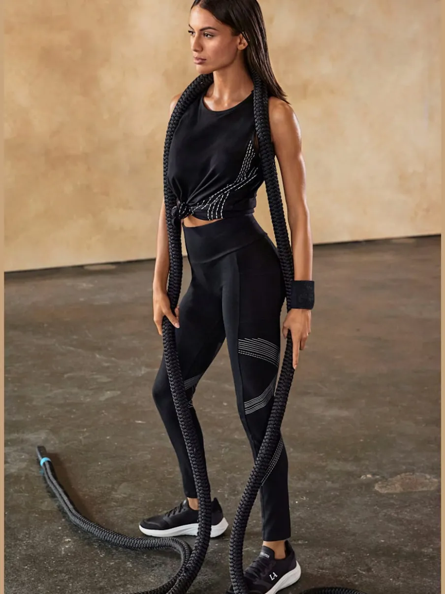 Leggings avec motifs réfléchissants et poche téléphone pratique