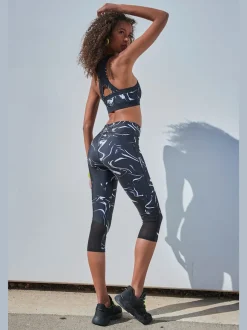 Leggings corsaires fonctionnels avec empiècements et poche zippée