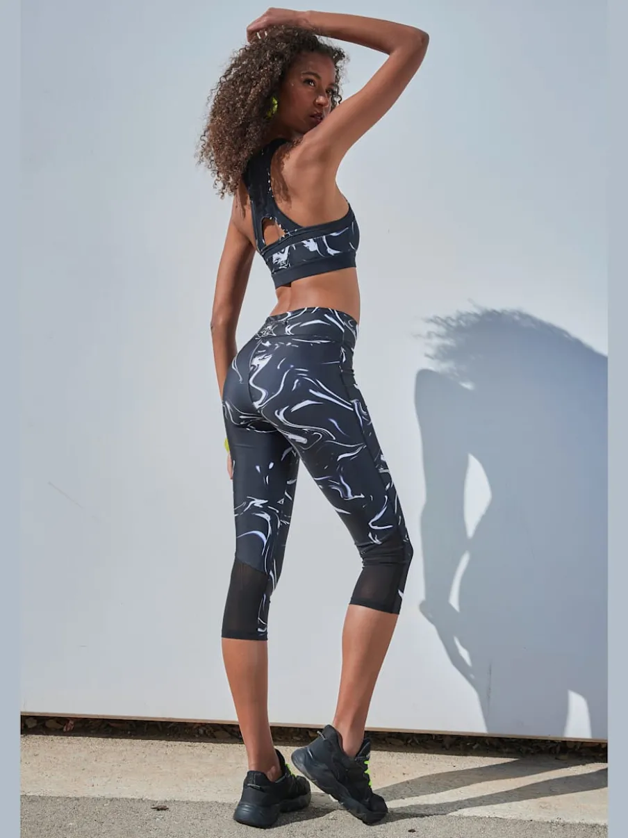 Leggings corsaires fonctionnels avec empiècements et poche zippée