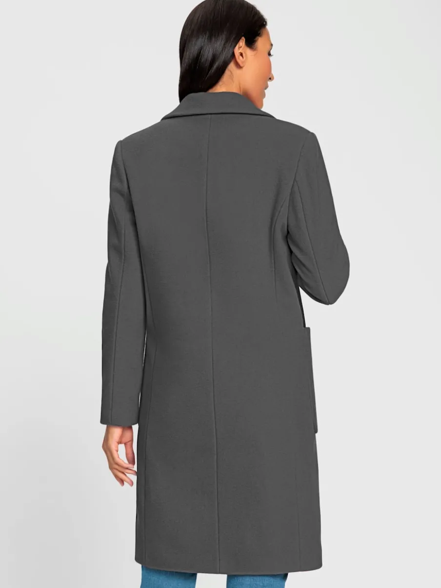 Manteau court à col revers avec grandes poches spacieuses