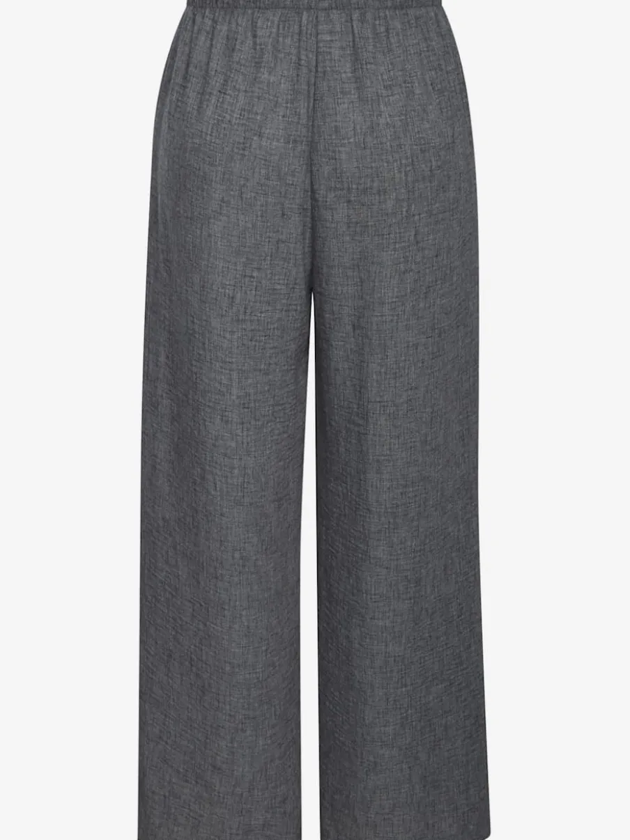 Pantalon ample avec ceinture et manches courtes en matière légère
