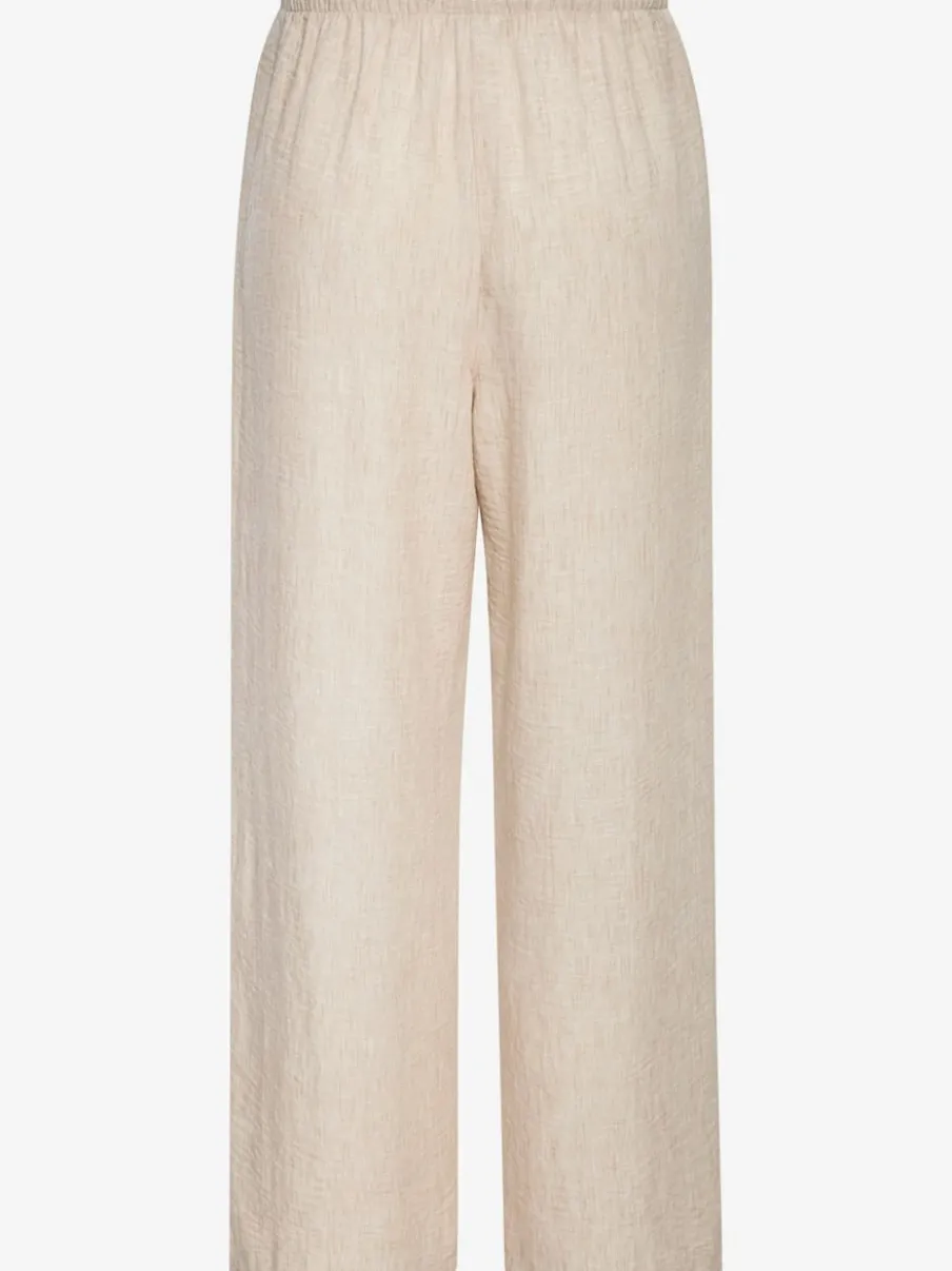 Pantalon ample avec ceinture et manches courtes en matière légère