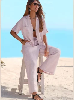 Pantalon ample avec ceinture et manches courtes en matière légère